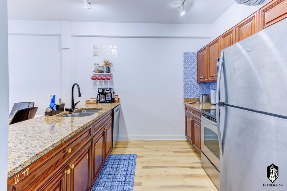 Kitchen or kitchenette, dishwasher, oven, stove