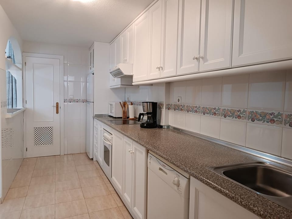 Kitchen or kitchenette, oven, stove