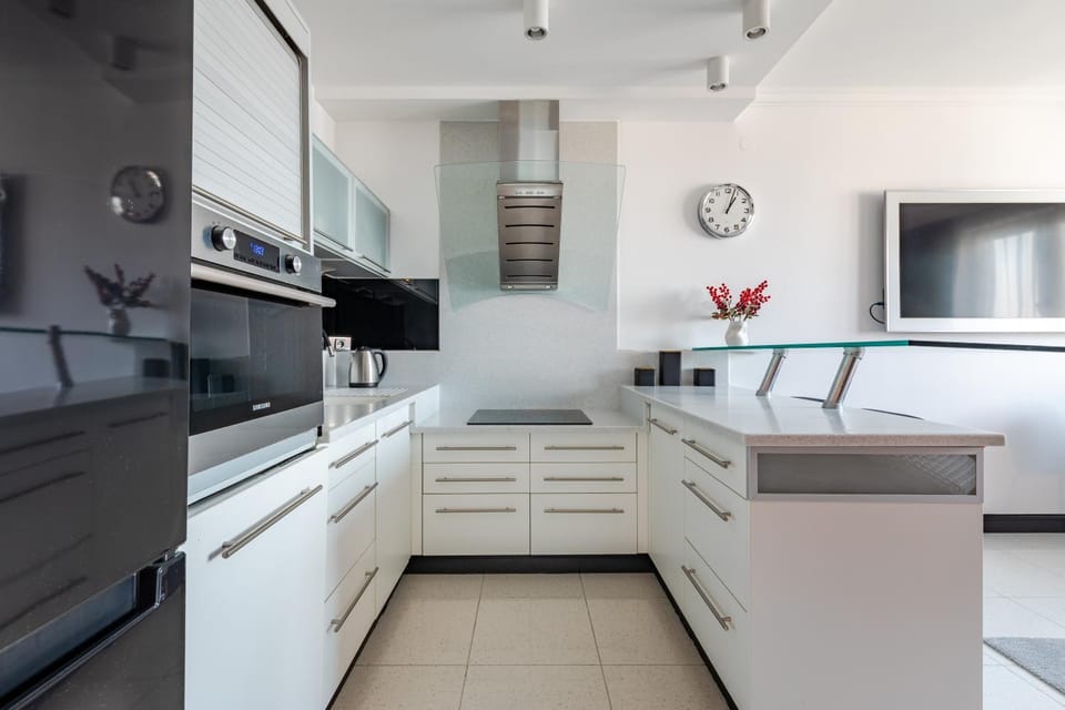 Kitchen or kitchenette, dishwasher, oven, stove