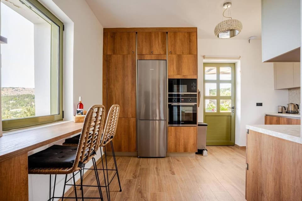 Kitchen or kitchenette, dishwasher, oven, stove