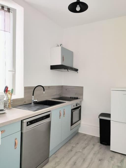Kitchen or kitchenette, dishwasher, oven, stove