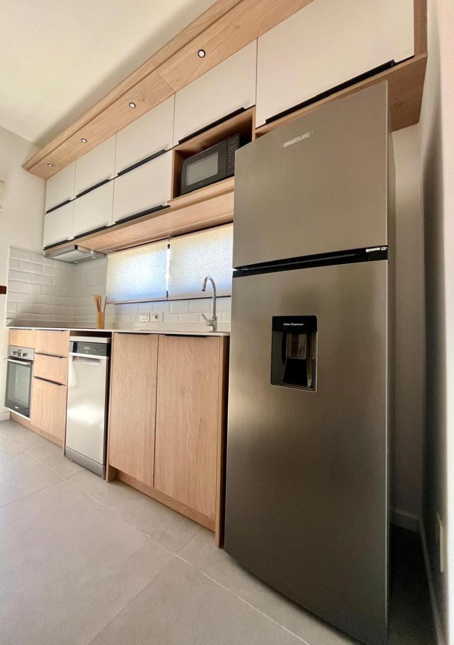 Kitchen or kitchenette, dishwasher, microwave, oven, stove