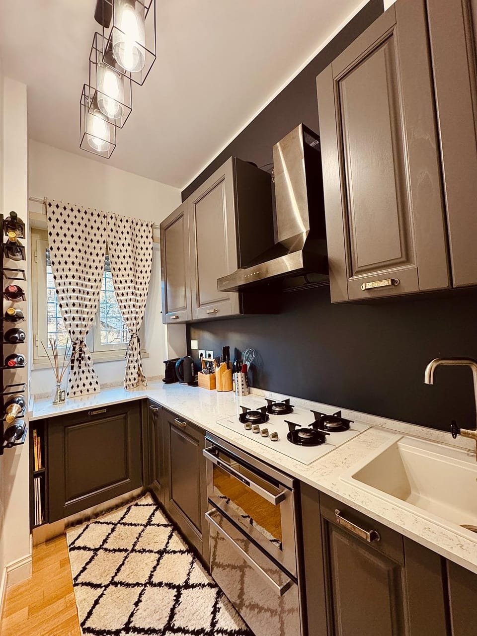 Kitchen or kitchenette, dishwasher, oven, stove