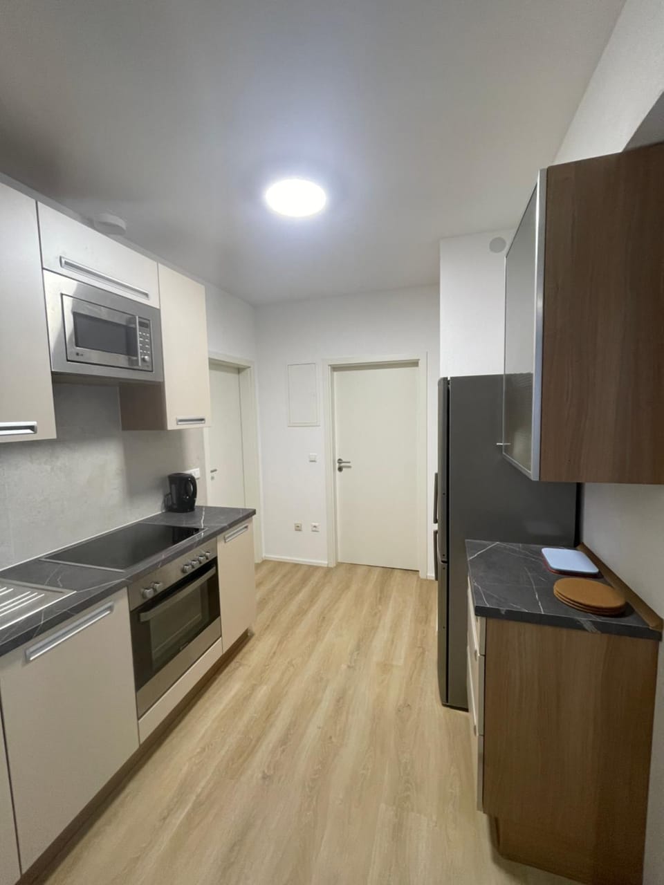 Kitchen or kitchenette, dishwasher, oven, stove