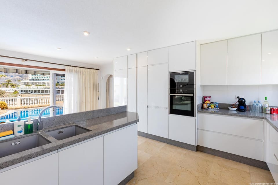 Kitchen or kitchenette, dishwasher, oven, stove