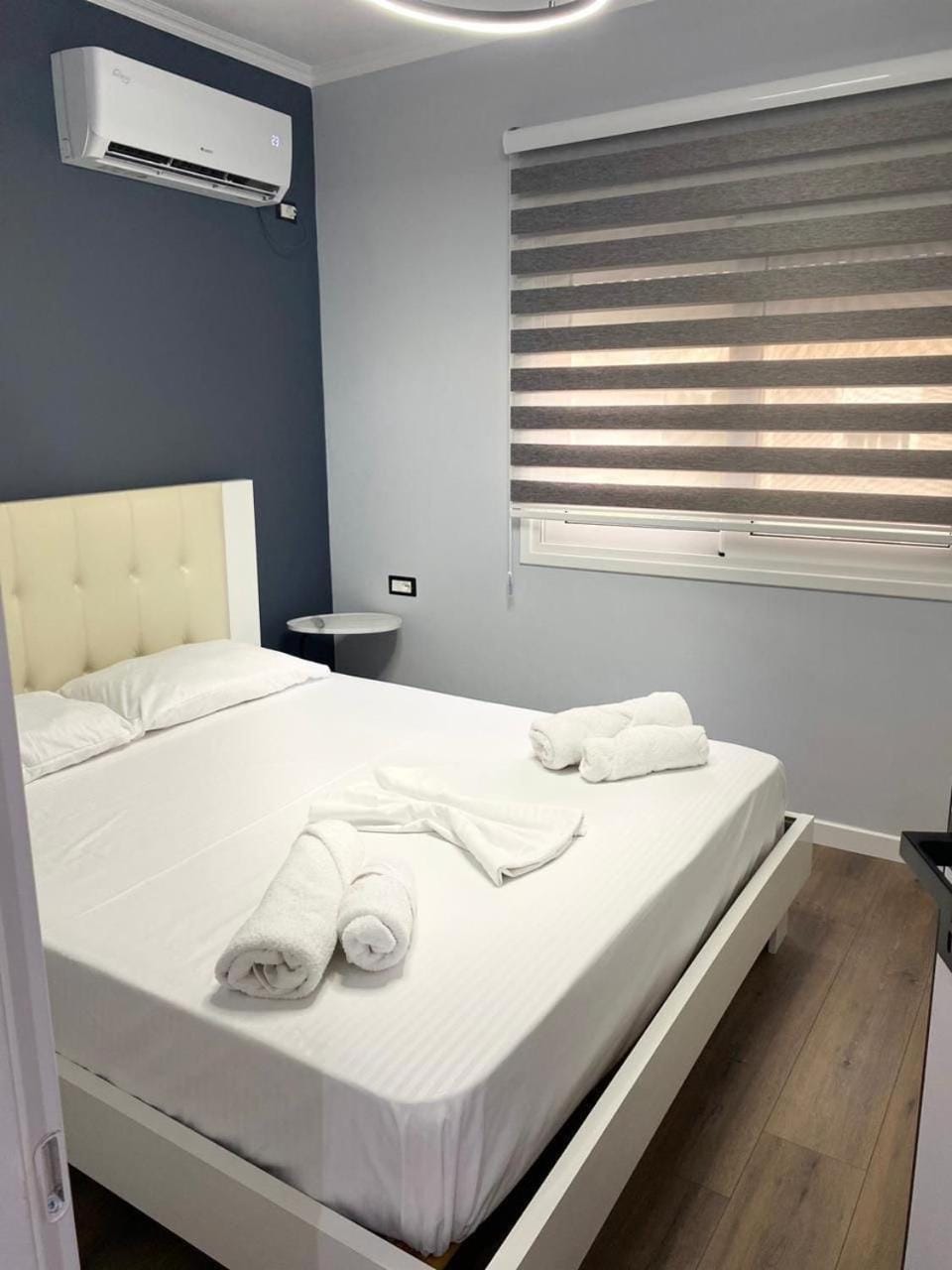 Bed, Photo of the whole room, Bedroom, towels, air conditioner
