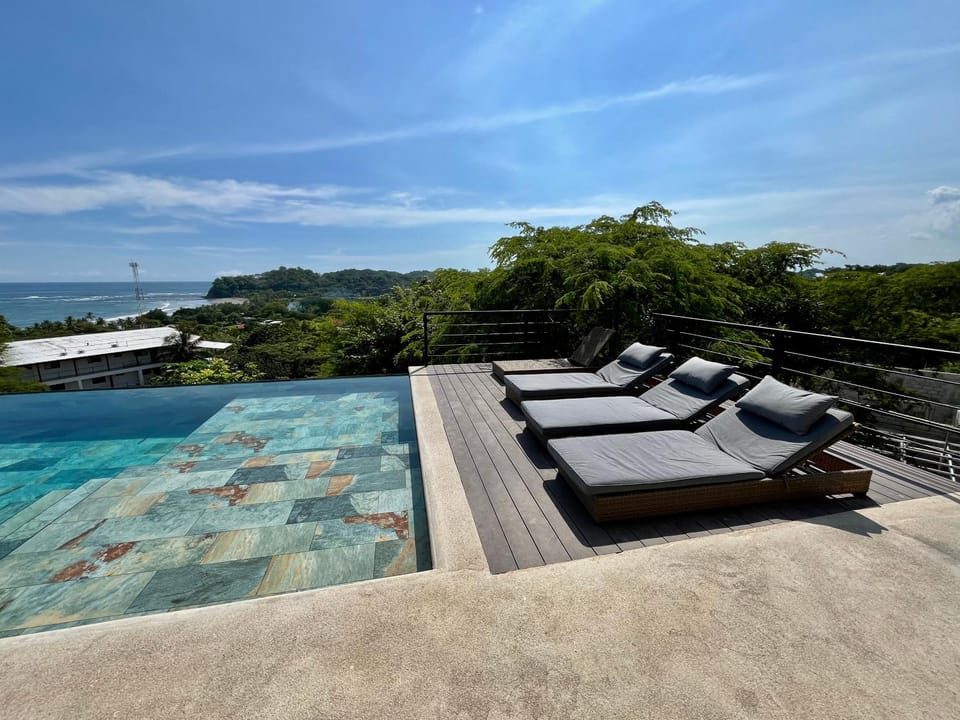 View (from property/room), Balcony/Terrace, Seating area, Pool view, Sea view, Swimming pool, Swimming pool, sunbed