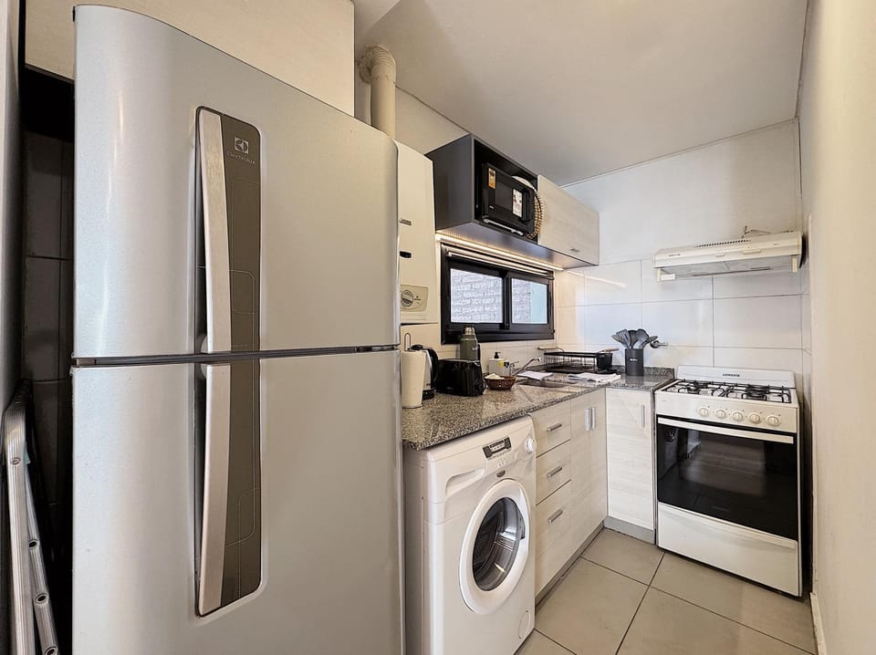 Kitchen or kitchenette, oven, toaster, washing machine