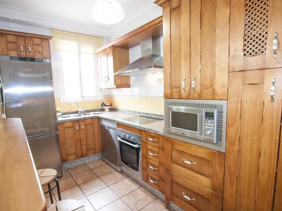 Kitchen or kitchenette, dishwasher, oven, stove, toaster