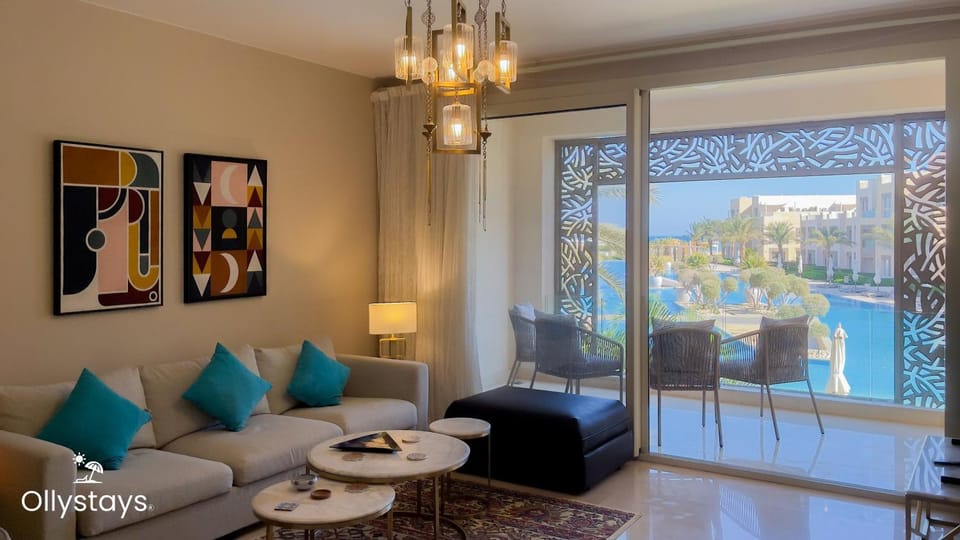 View (from property/room), Balcony/Terrace, Living room, Seating area, Pool view, Sea view