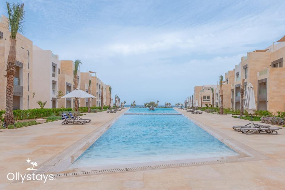 Property building, Property logo or sign, Pool view, Swimming pool