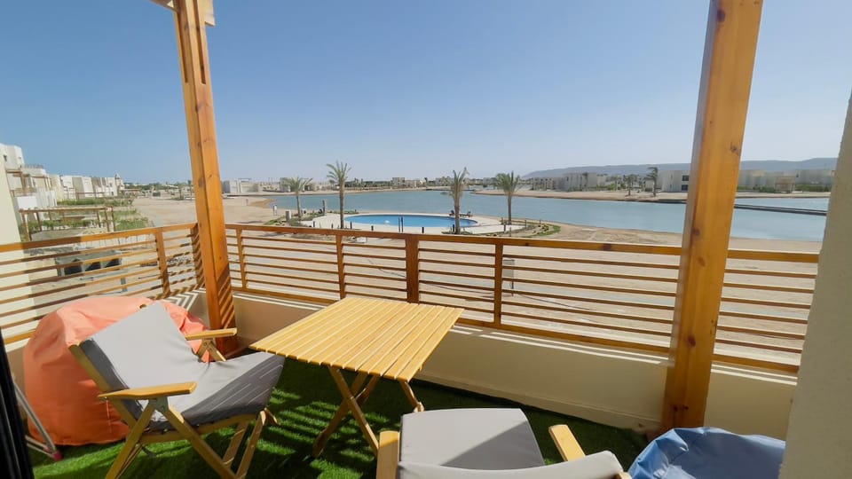Patio, View (from property/room), Balcony/Terrace, Living room, Beach, Beach, Lake view, Sea view