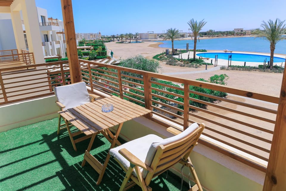 Property building, Patio, Day, View (from property/room), Balcony/Terrace, Living room, Seating area, Lake view, Pool view, River view, Sea view, Swimming pool