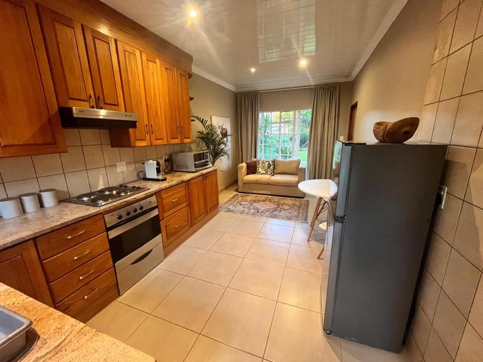 Kitchen or kitchenette, Living room, Seating area, Dining area, oven, stove, toaster