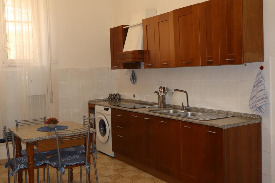 Kitchen or kitchenette, stove, washing machine, kitchen