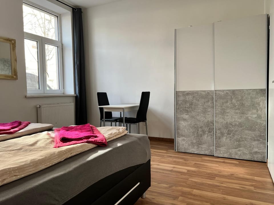 Bed, Seating area, Bedroom, towels, wardrobe