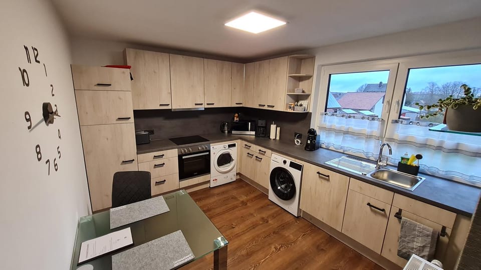 Kitchen or kitchenette, dishwasher, stove, washing machine, dryer