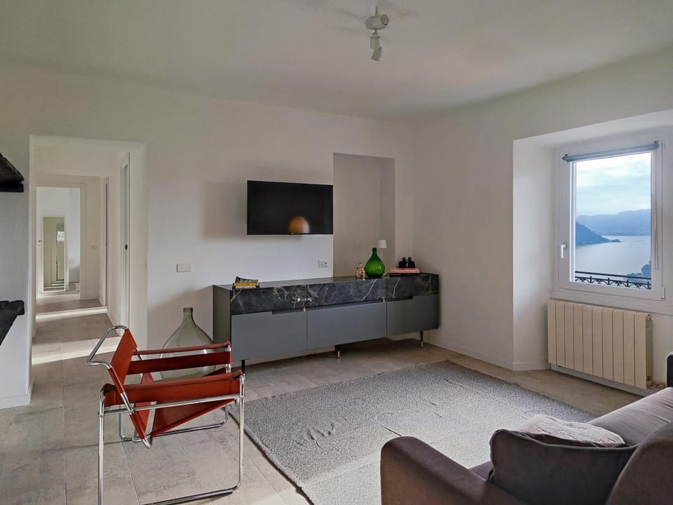 TV and multimedia, Living room, Seating area, Lake view, Landmark view, Mountain view