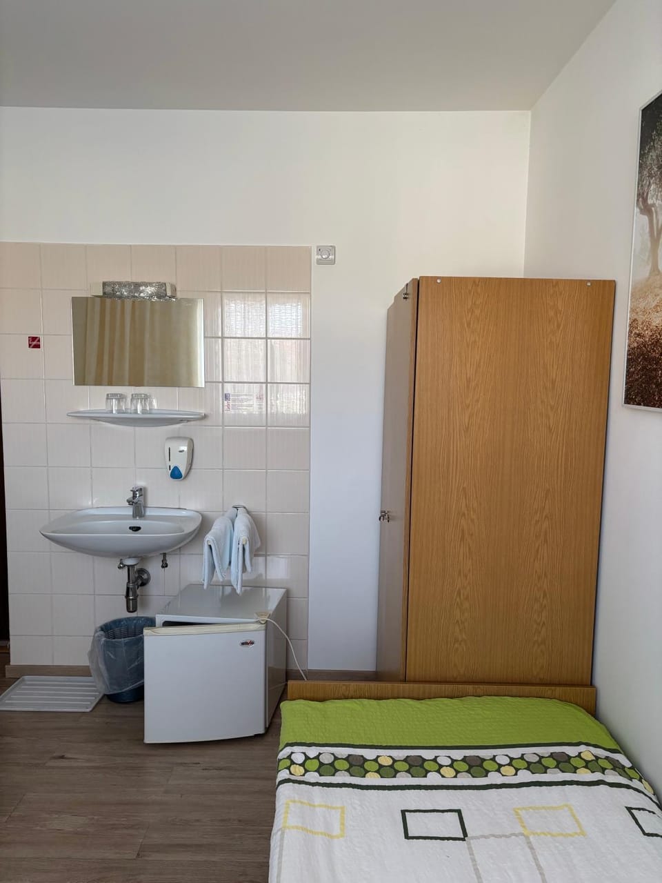 Bed, towels, wardrobe