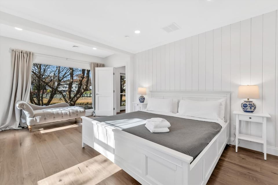 Waterfront Retreat with Private Dock and Fire Pit, Sleeps 8, Outdoor Dining, Spa-Style Primary, Gourmet Kitchen with Dual Dishwashers, Gas Fireplace, River Views, Bright Open Layout, Central AC, Perfect Coastal Escape for Families, 24 Hr Hospitality House in East Falmouth