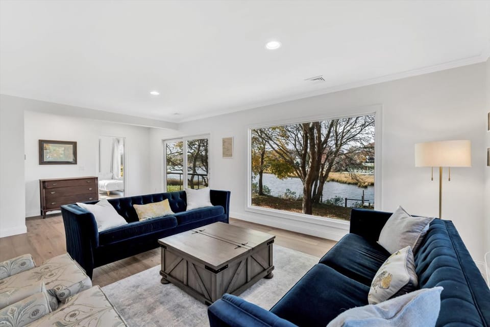 Waterfront Retreat with Private Dock and Fire Pit, Sleeps 8, Outdoor Dining, Spa-Style Primary, Gourmet Kitchen with Dual Dishwashers, Gas Fireplace, River Views, Bright Open Layout, Central AC, Perfect Coastal Escape for Families, 24 Hr Hospitality House in East Falmouth