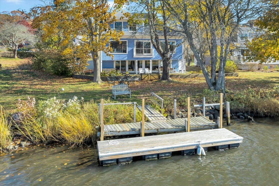 Waterfront Retreat with Private Dock and Fire Pit, Sleeps 8, Outdoor Dining, Spa-Style Primary, Gourmet Kitchen with Dual Dishwashers, Gas Fireplace, River Views, Bright Open Layout, Central AC, Perfect Coastal Escape for Families, 24 Hr Hospitality House in East Falmouth