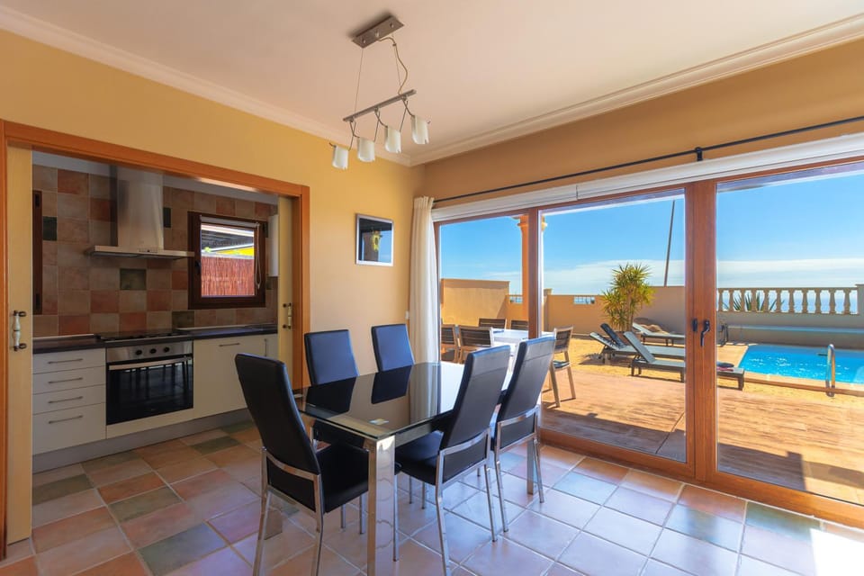 Kitchen or kitchenette, Dining area, Pool view