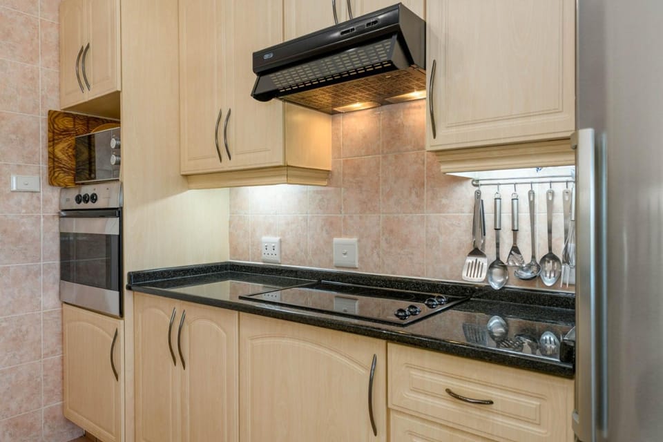 Kitchen or kitchenette, microwave, oven, stove