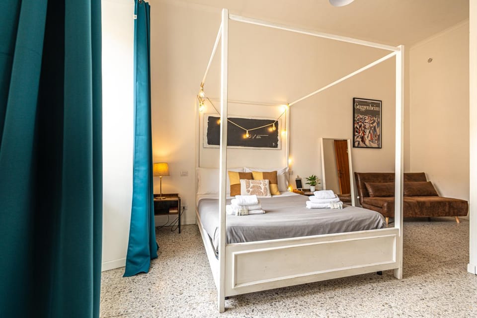 Bed, Photo of the whole room, Decorative detail, Bedroom, hair dryier, towels, air conditioner