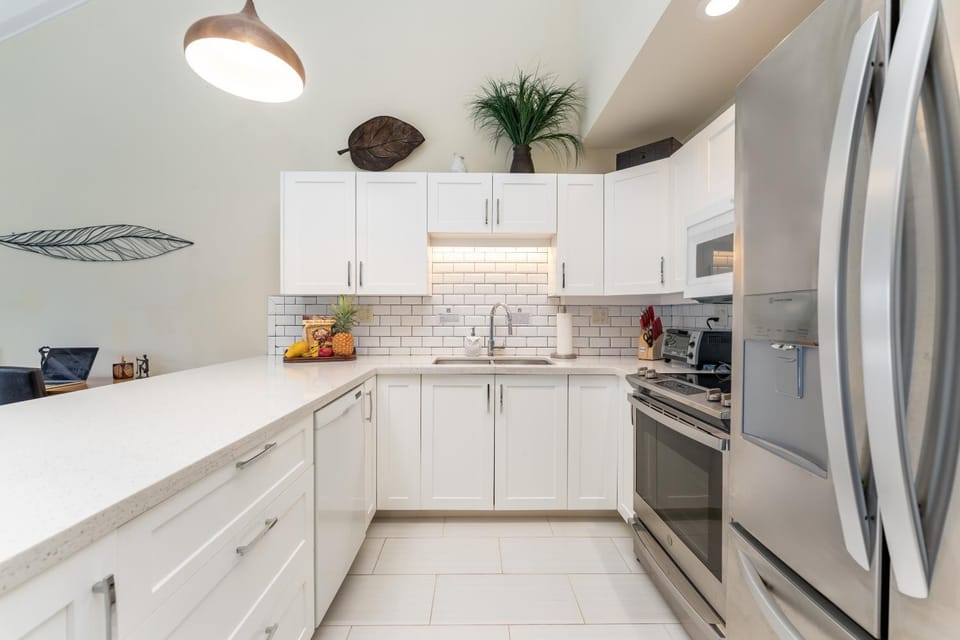 Kitchen or kitchenette, dishwasher, oven, stove