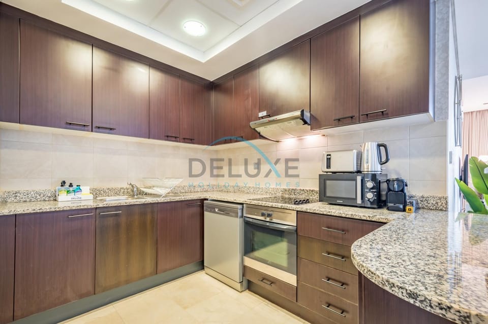 Kitchen or kitchenette, dishwasher, stove, toaster