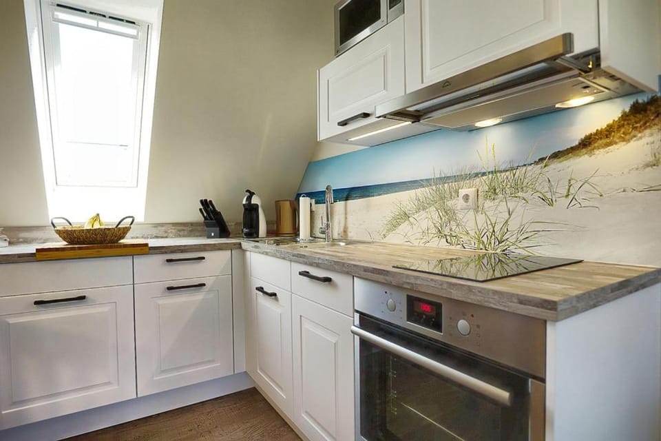 Kitchen or kitchenette, dishwasher, oven, stove