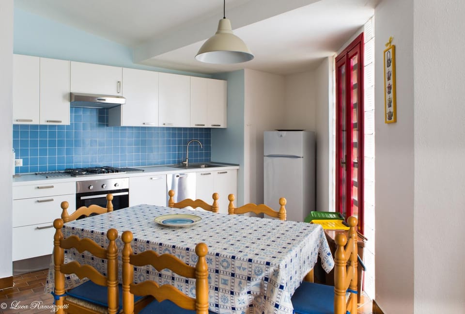 Kitchen or kitchenette, dishwasher, oven, stove