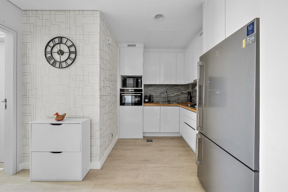 Kitchen or kitchenette, dishwasher, oven, stove
