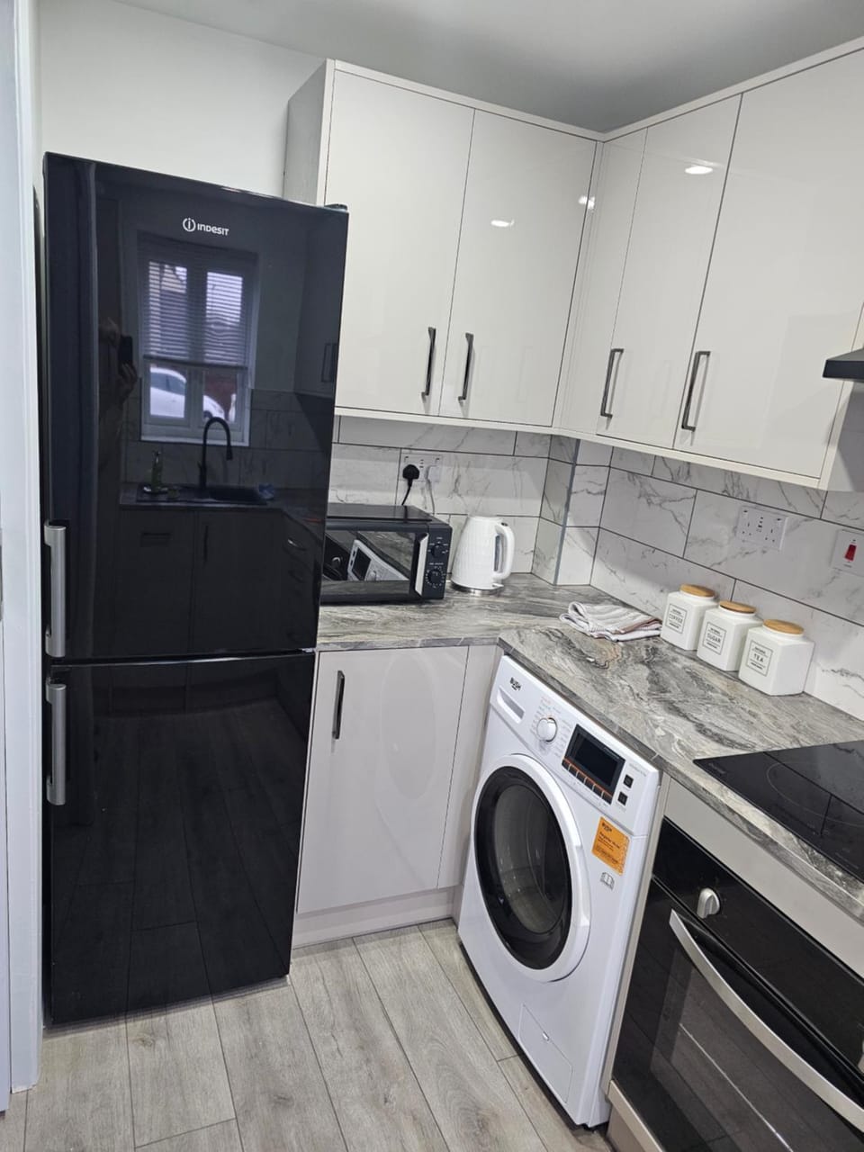 Kitchen or kitchenette, dishwasher, oven, stove, washing machine, dryer