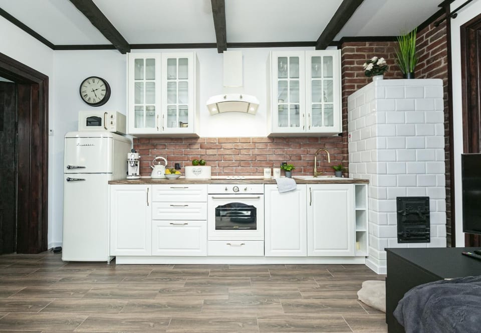 Kitchen or kitchenette, fireplace, microwave, oven, stove, kitchen