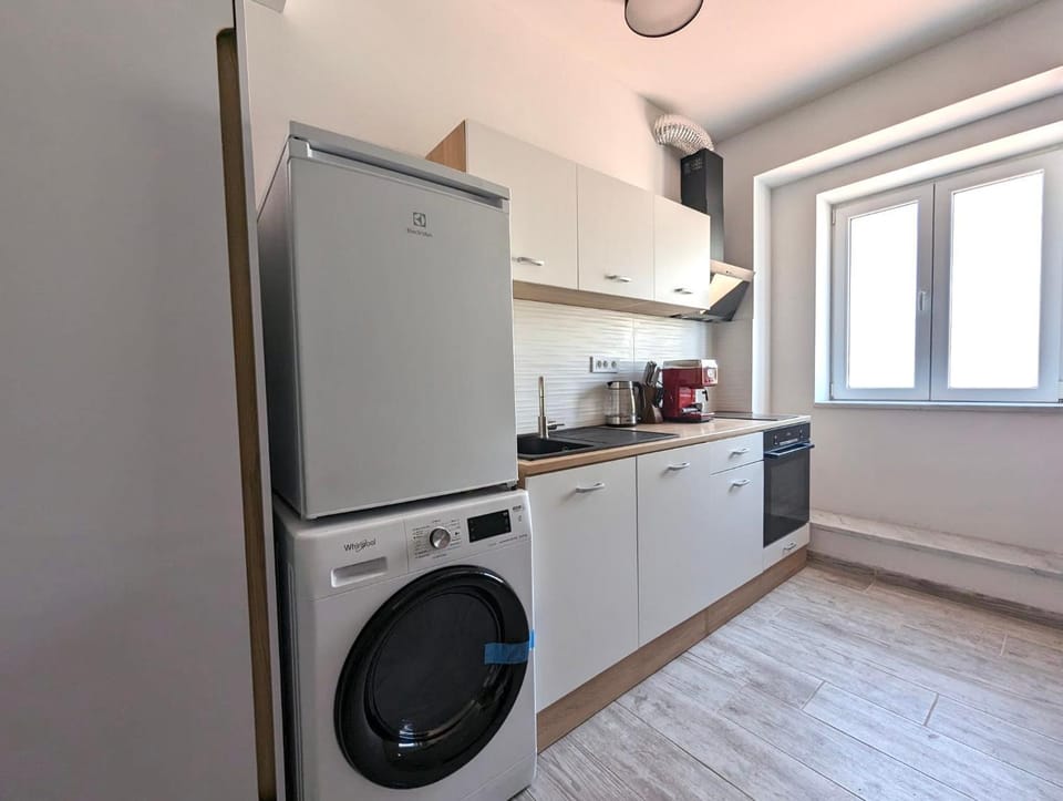 Kitchen or kitchenette, washing machine