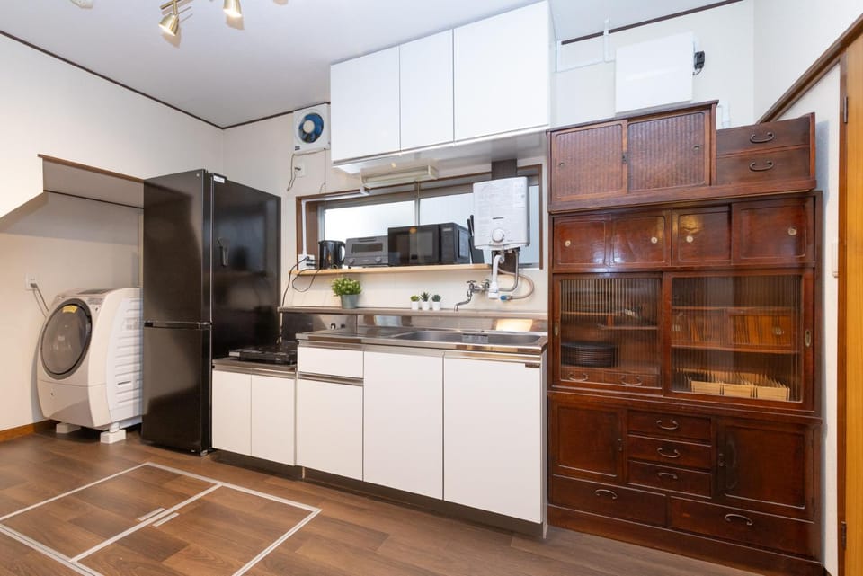 Kitchen or kitchenette, stove, washing machine