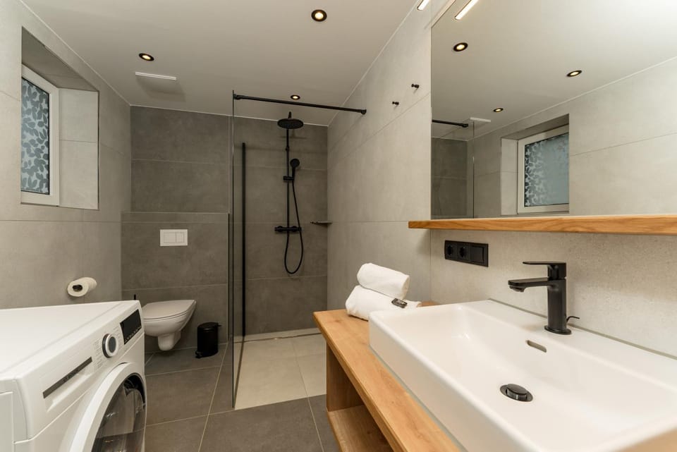 Shower, Toilet, Bathroom, towels, washing machine, dryer