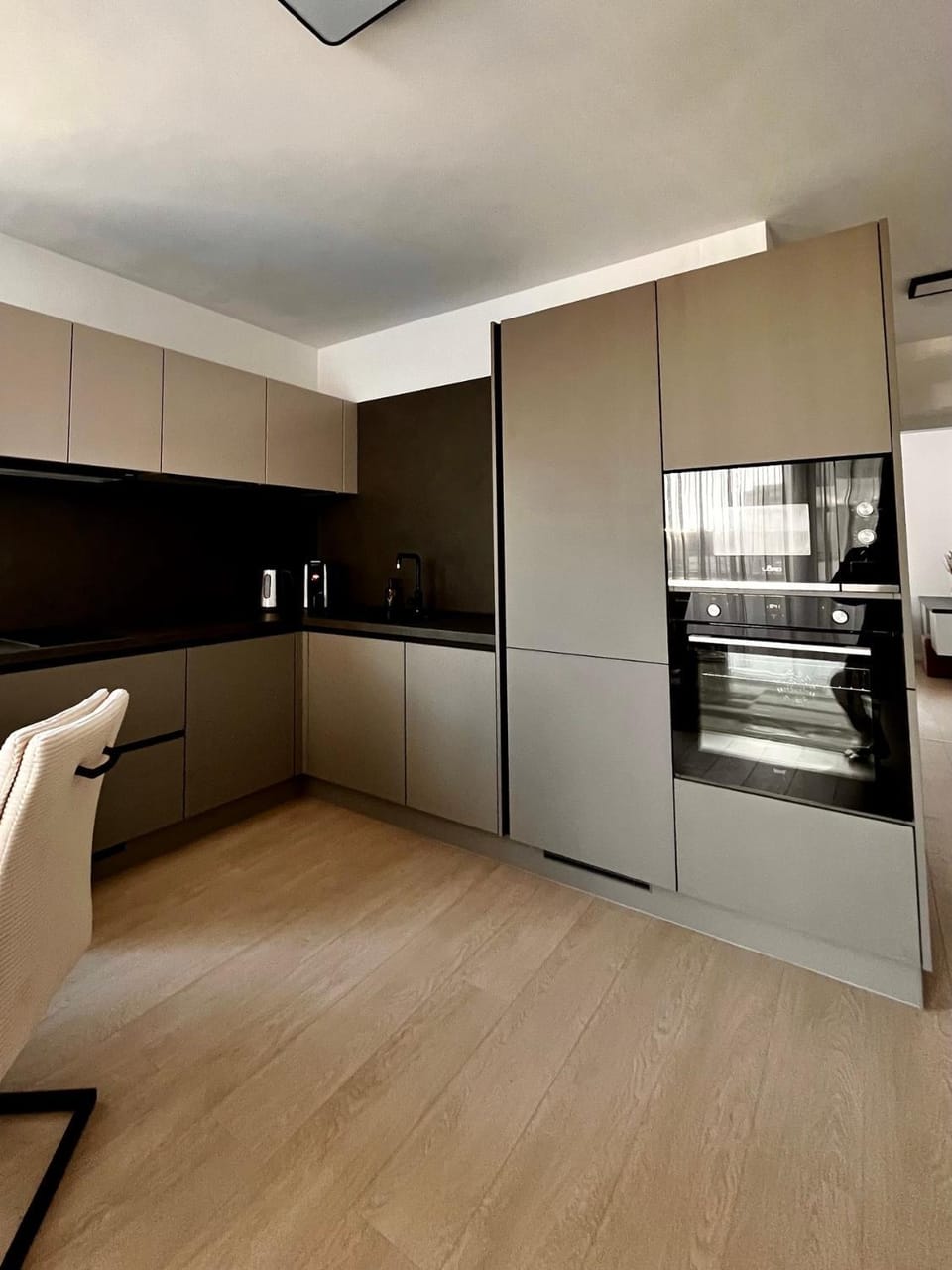Kitchen or kitchenette, dishwasher, oven, stove