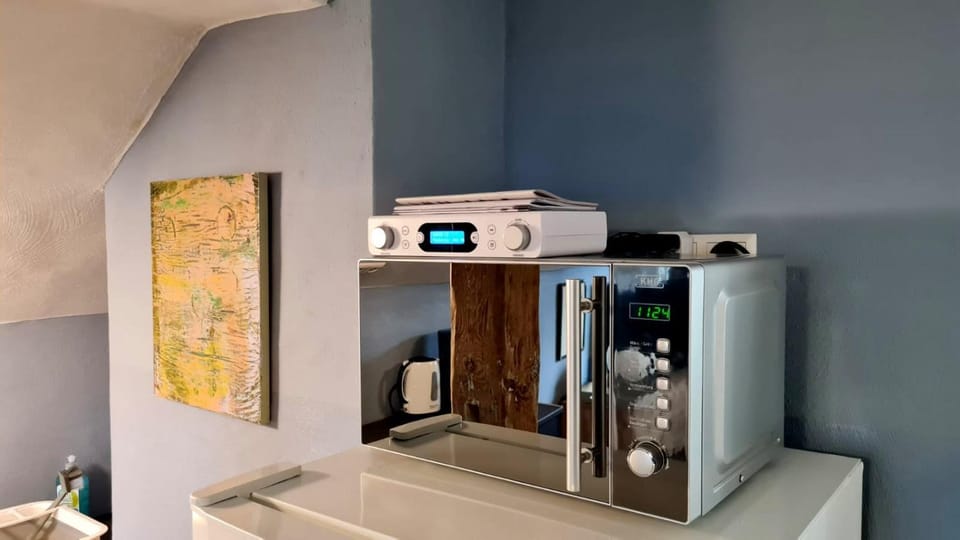 Kitchen or kitchenette, microwave