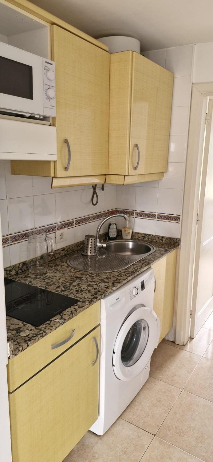 Kitchen or kitchenette, stove, washing machine