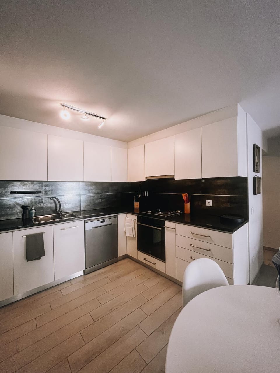 Kitchen or kitchenette, dishwasher, oven, stove