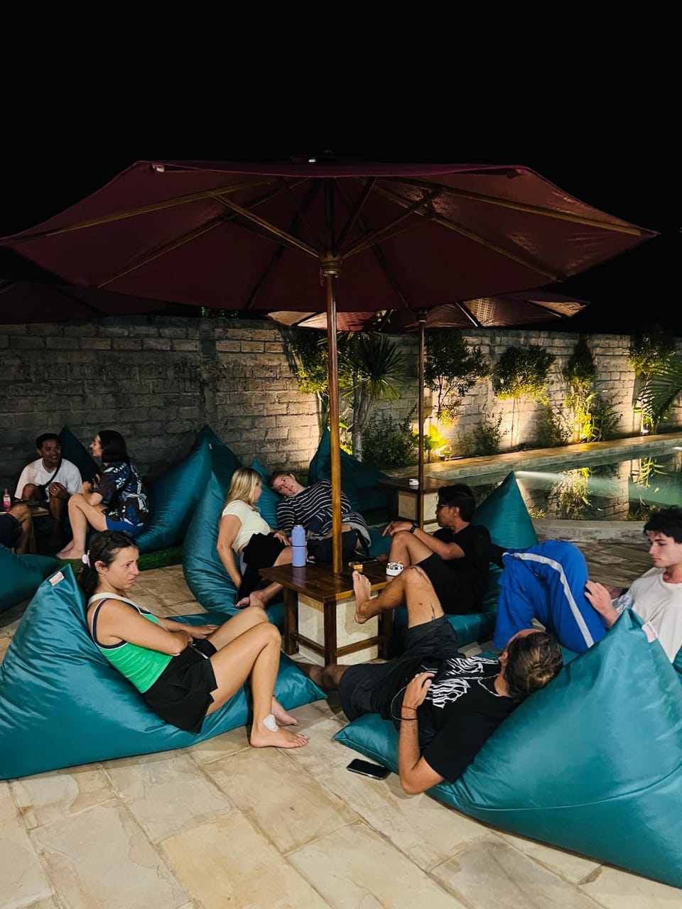 Night, People, View (from property/room), Living room, Pool view, Swimming pool, group of guests