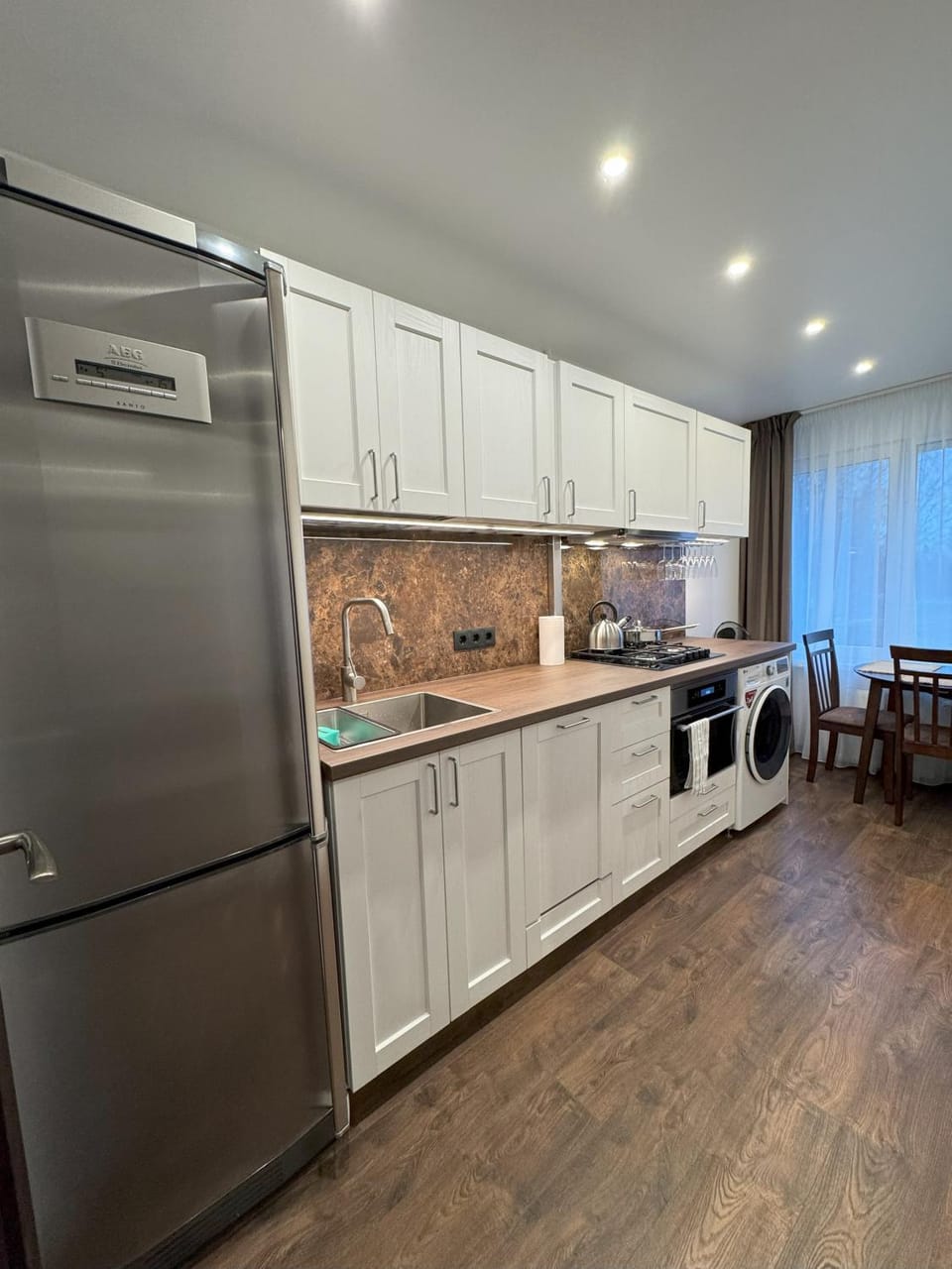 Kitchen or kitchenette, Dining area, dishwasher, oven, stove, washing machine, dryer