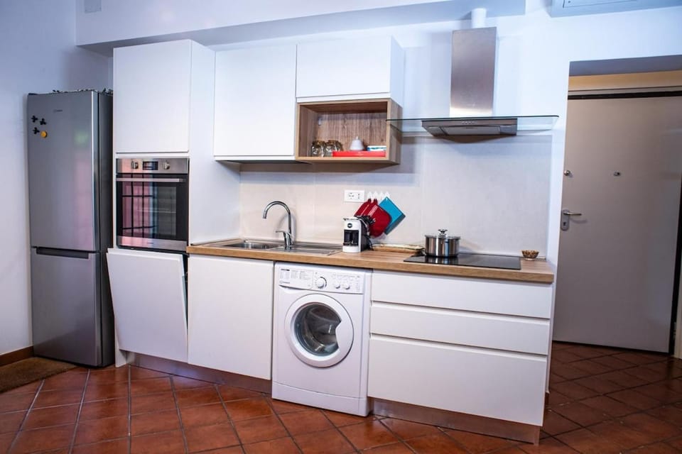 Kitchen or kitchenette, dishwasher, oven, stove, toaster, washing machine