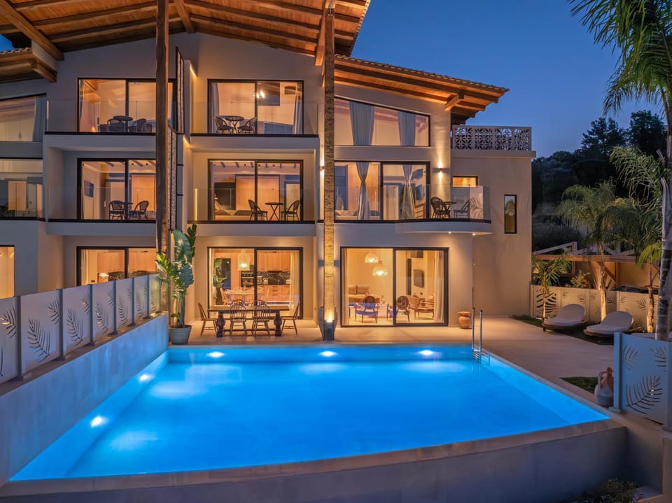 Property building, Patio, Night, Pool view, Swimming pool, sunbed
