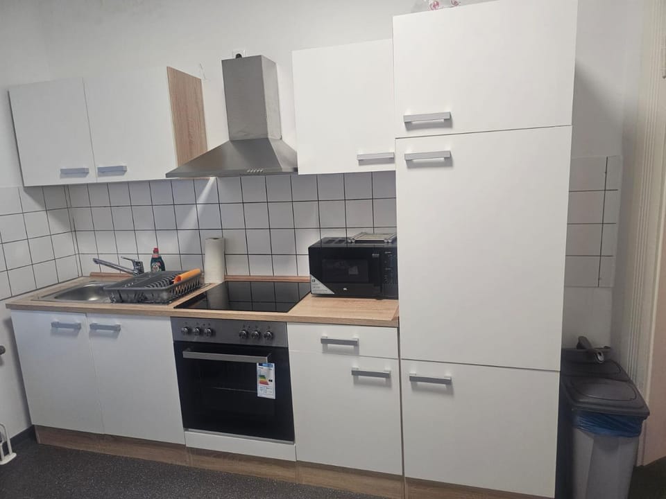 Kitchen or kitchenette, dishwasher, oven, stove