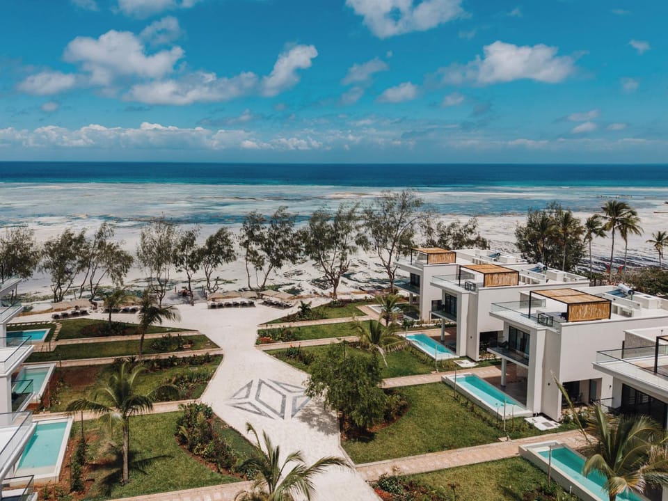 Property building, Nearby landmark, Day, Natural landscape, Bird's eye view, Beach, Sea view, sunbed