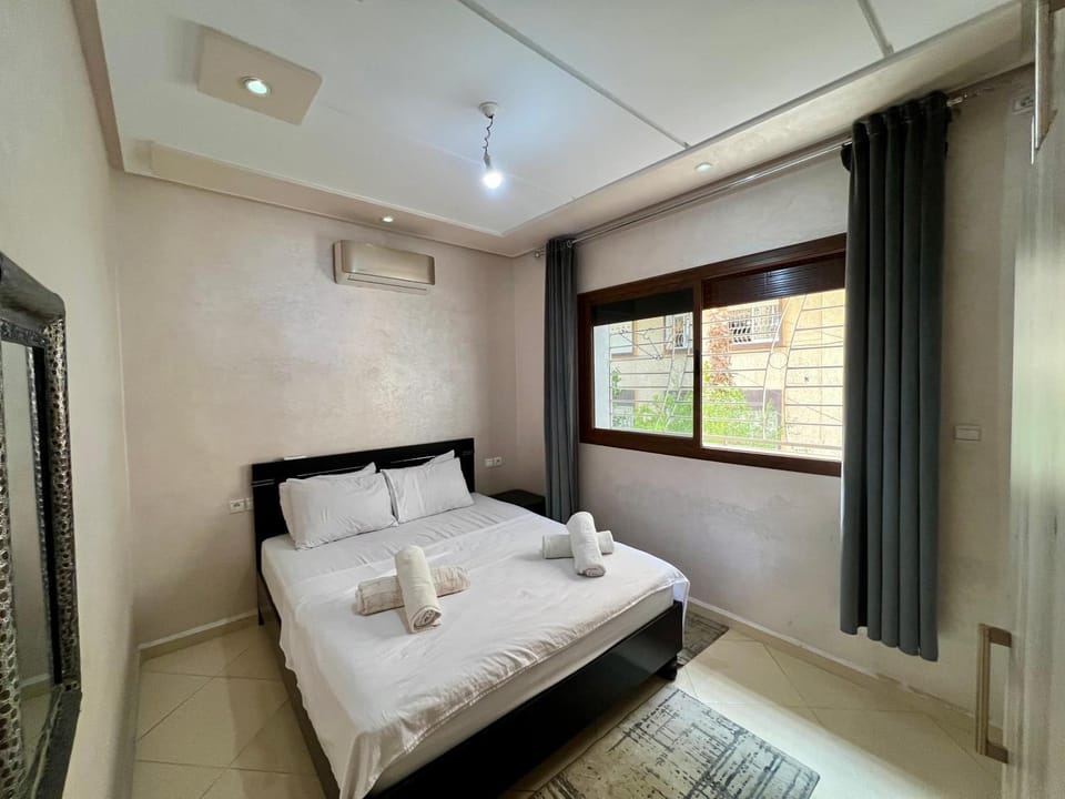 Bed, Photo of the whole room, Bedroom, towels, air conditioner